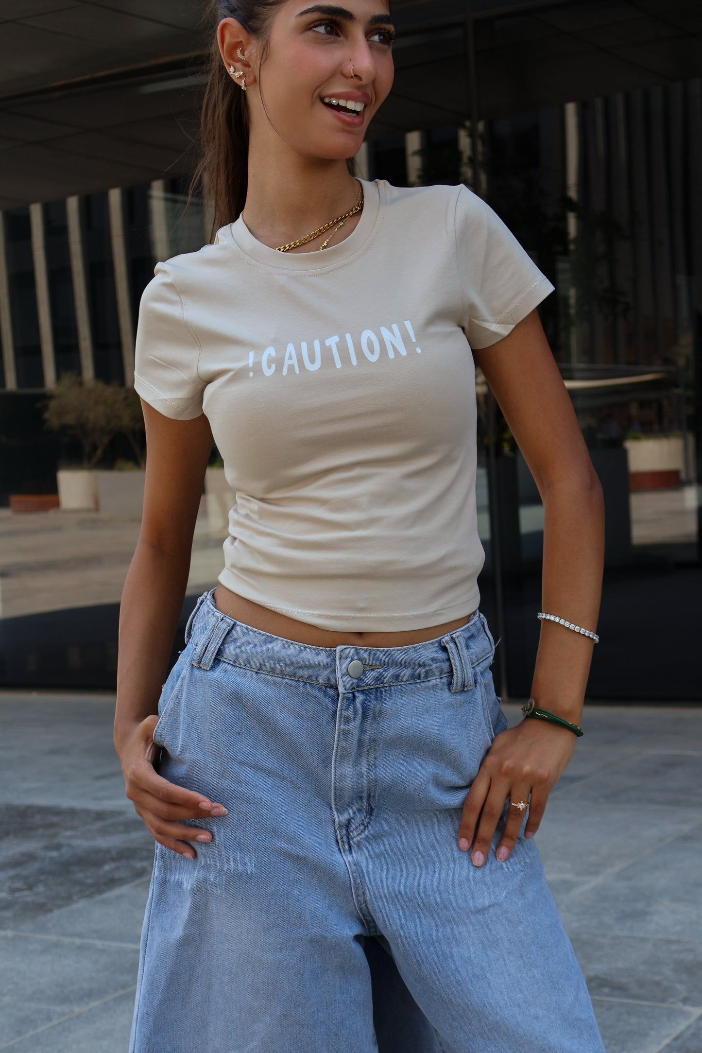 ⁠⁠Printed beige caution top